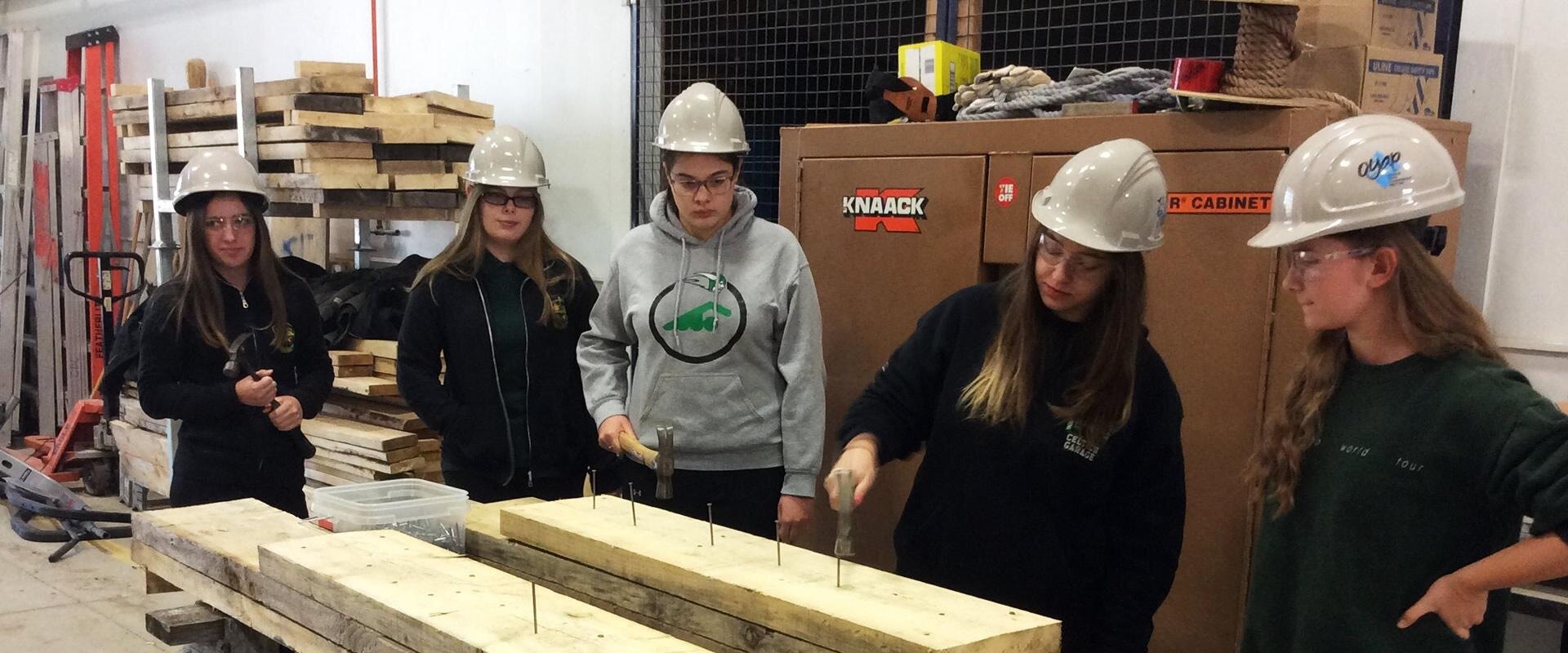 Students using hammers